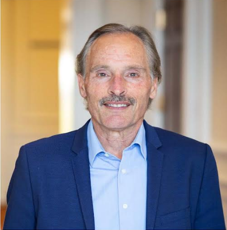 headshot of David C Nieman in a navy blue blazer and lighter blue button up