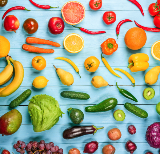 Assorted vegetables and fruits organized by a gradient color