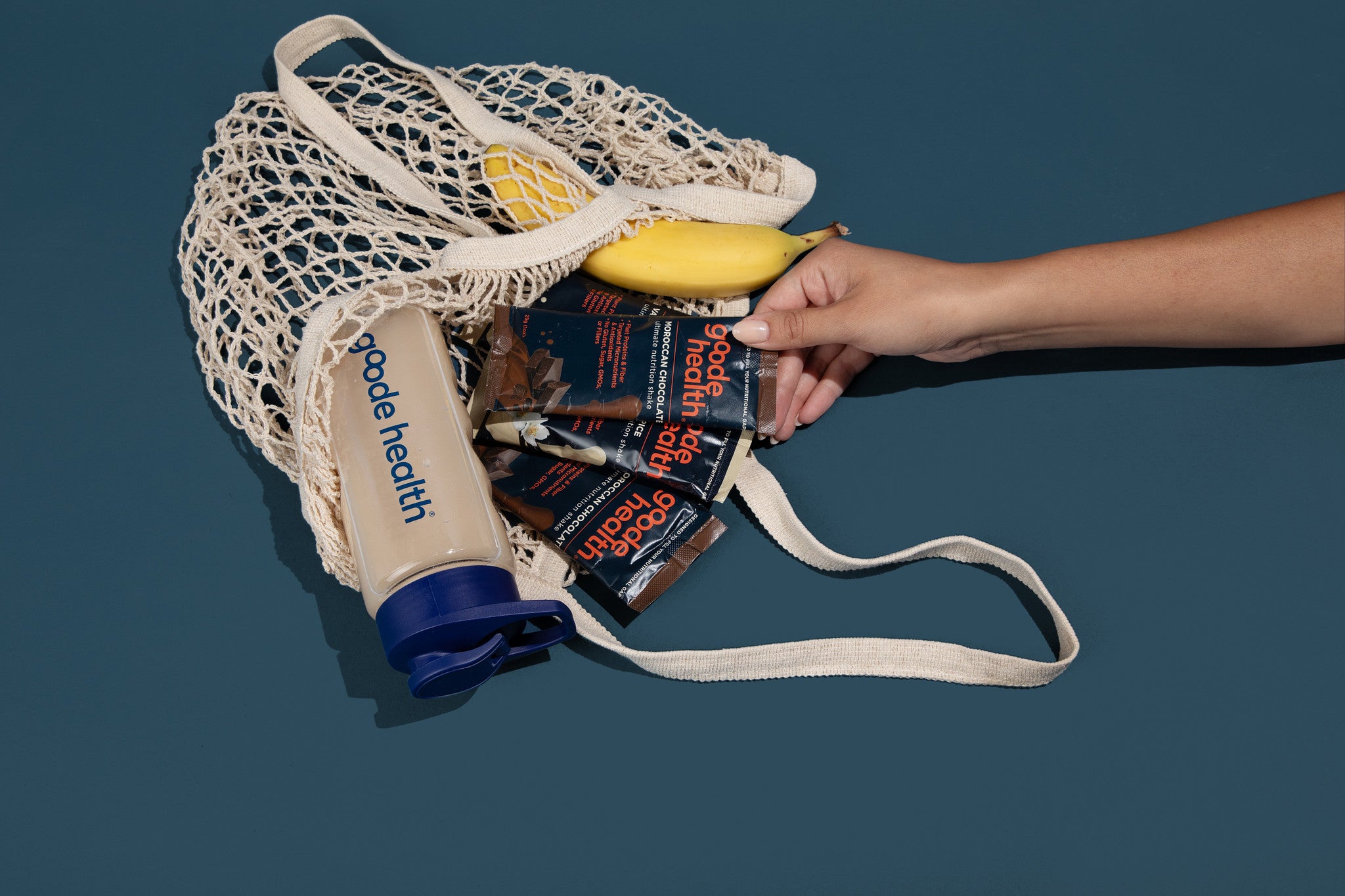 goode health on the go, sachet, single serve packs moroccan chocolate in bag with shaker and banana